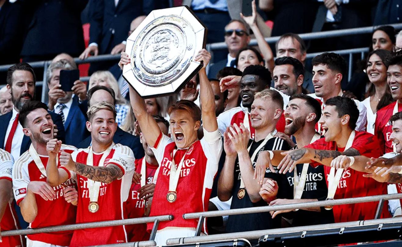 Martin Odegaard lifts the Community Shield